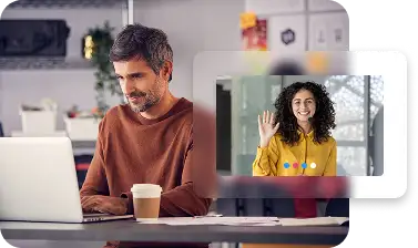 Partner working on a laptop during a live support video call, receiving technical assistance and training